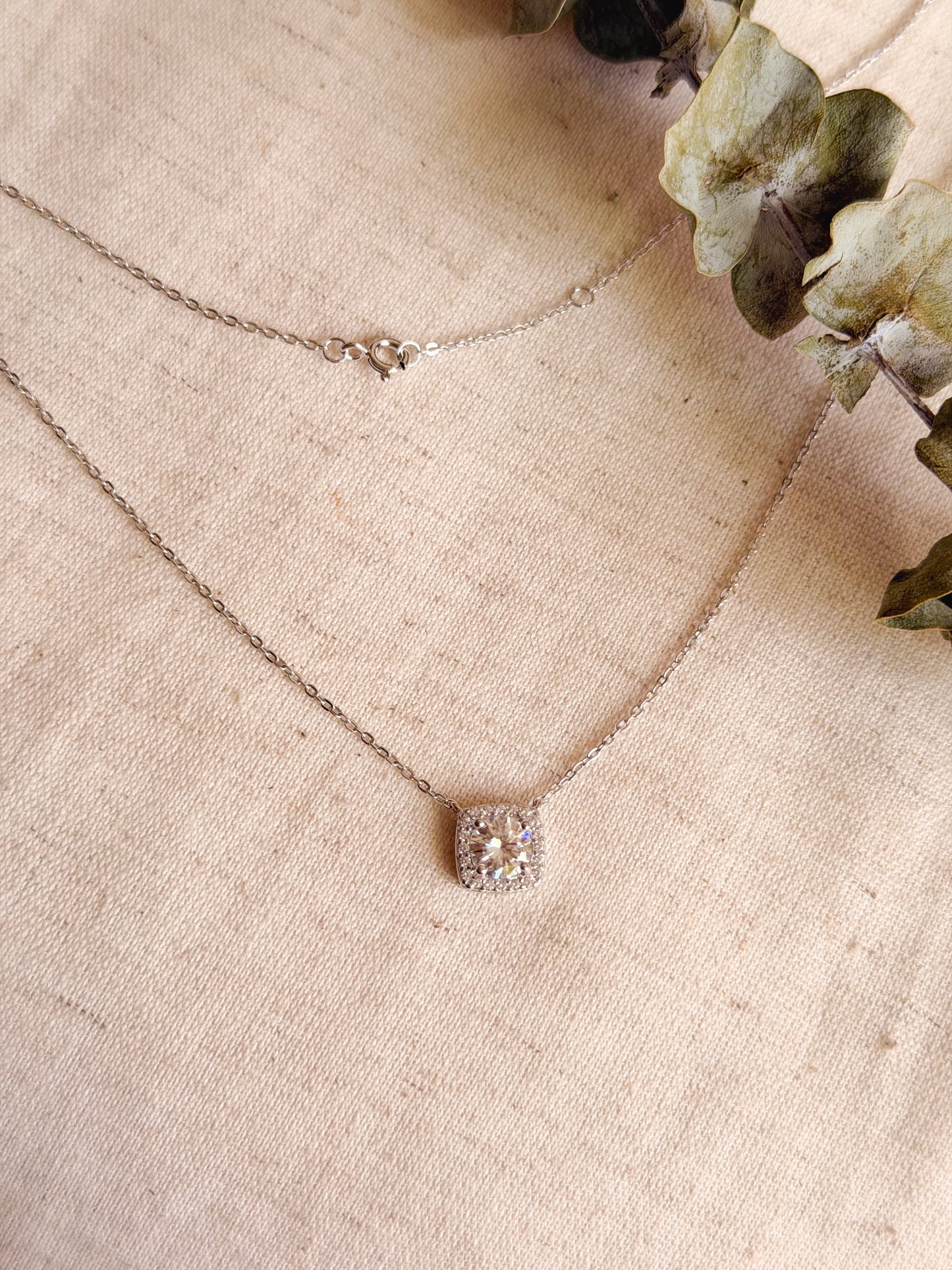 Cubic silver chain with zircon solitaire.